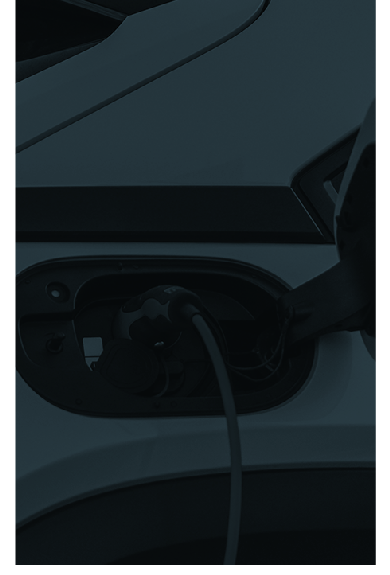 Electric vehicle plugged into a charging outlet